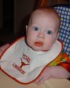 Emery at 5 months (Feb. 2004) -- decked out in his Longhorn bib! (and covered with baby food)